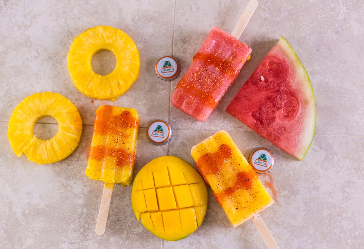 Fruit popsicles with pineapple and watermelon pieces