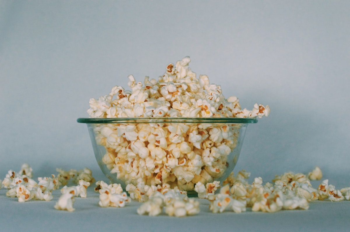A bowl of glossy honey-coated popcorn