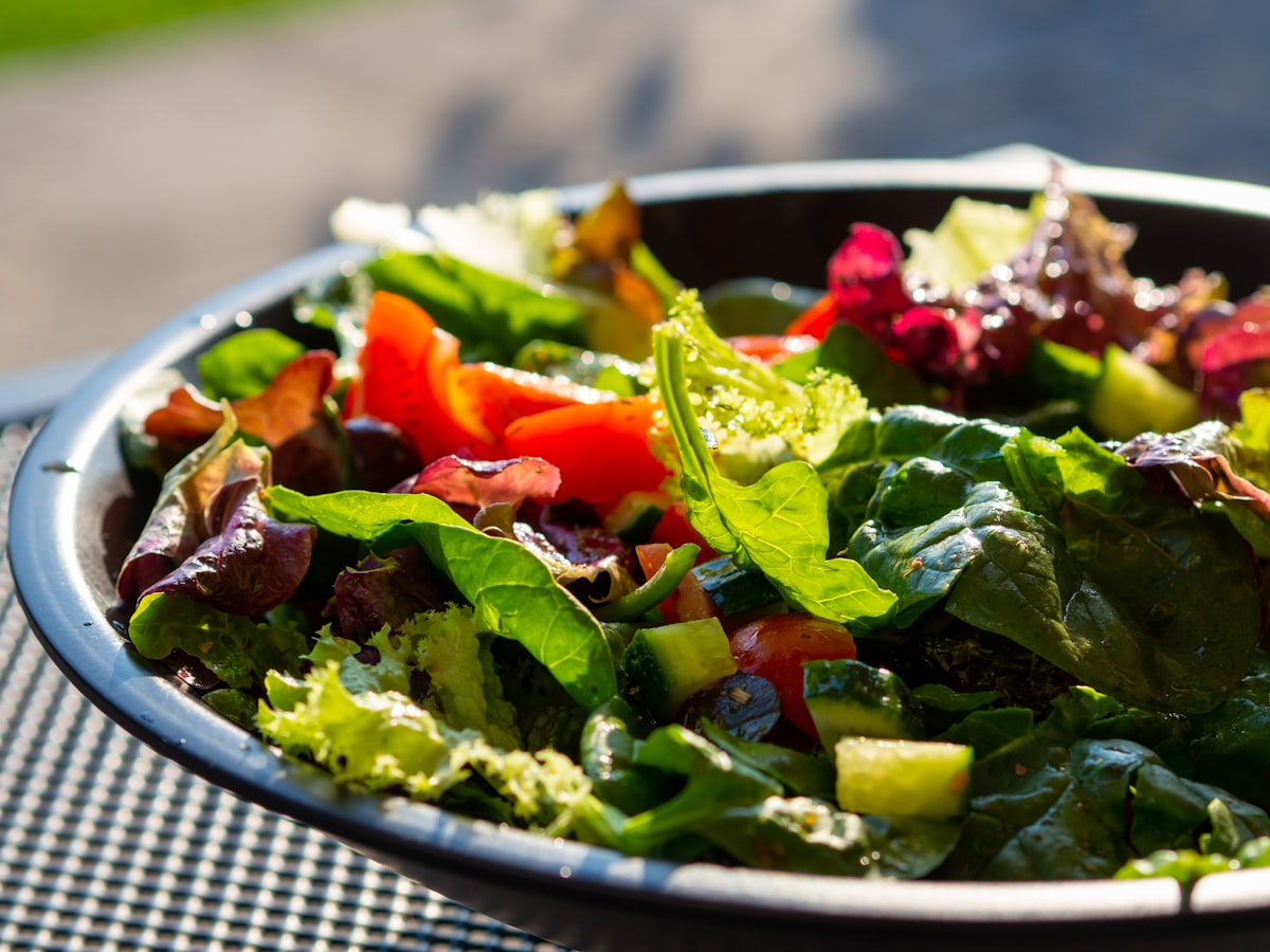 A fresh green salad with herbs and lemon vinaigrette